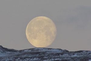 Moon over snowy mountains - original photograph by Stella Irving Photography