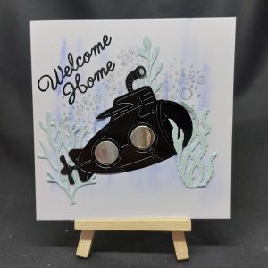 Handmade greetings card with the caption 'Welcome Home' and a picture of a submarine - created by Bat Cave Cards
